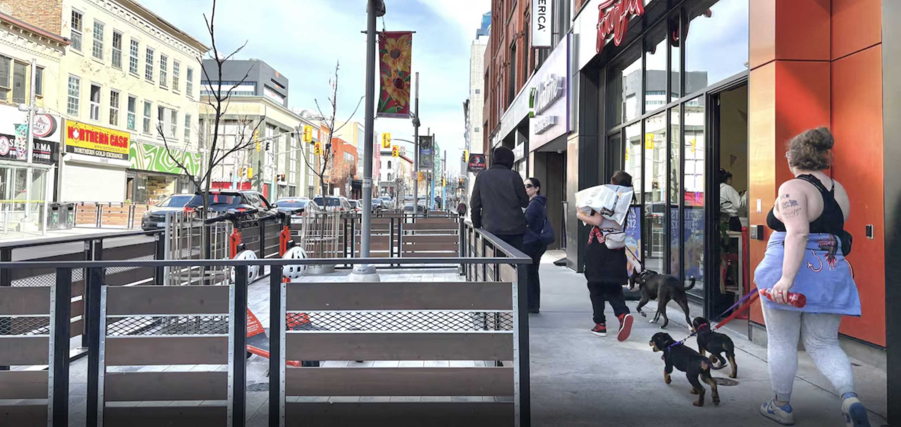 People around a street patio outside downtown Kitchener